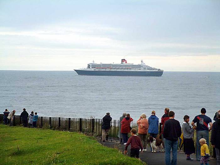 Queen Mary 2 gazed upon from Tynemouth as she heads north towards Edinburgh. 12 july 2004